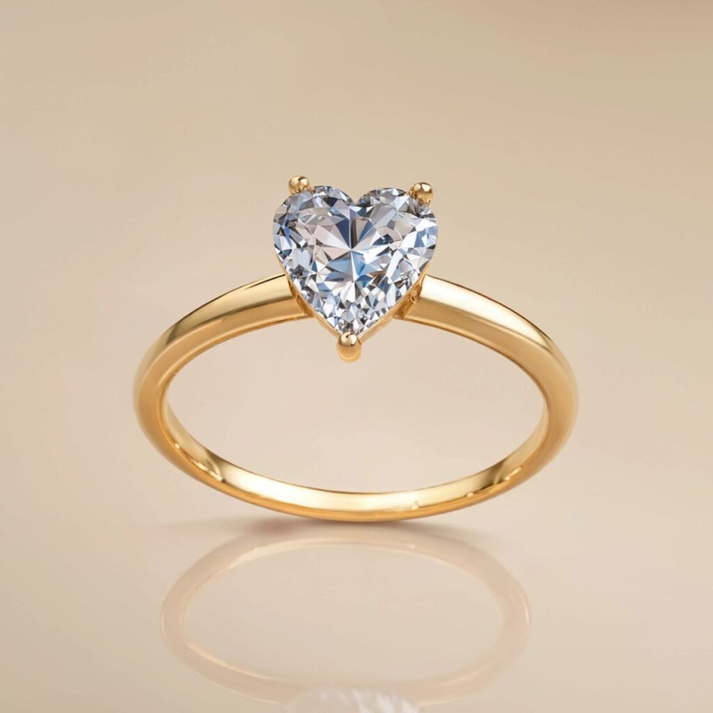 Verlobungsring in Gelbgold mit großem Herzdiamant. Erhältlich bei Juwelier Weiss